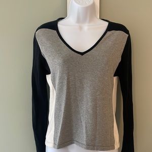 The limited grey, cream, and black long sleeve shirt